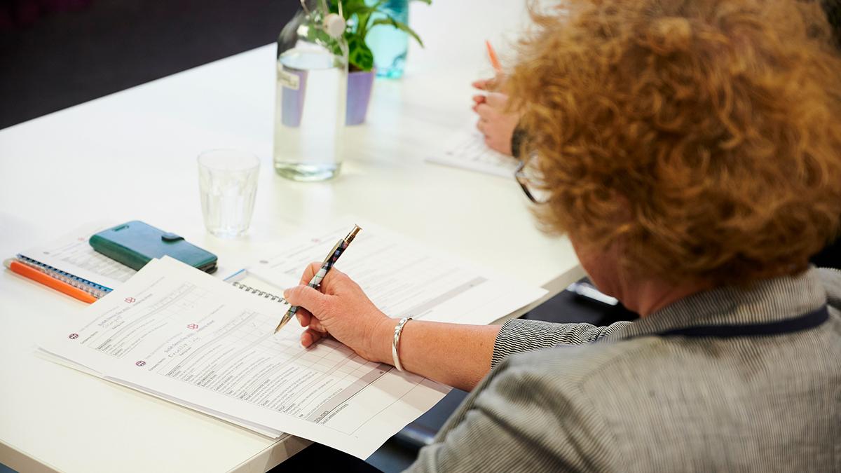 Researcher completing paperwork