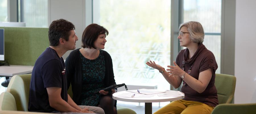 Three people meeting to discuss ideas