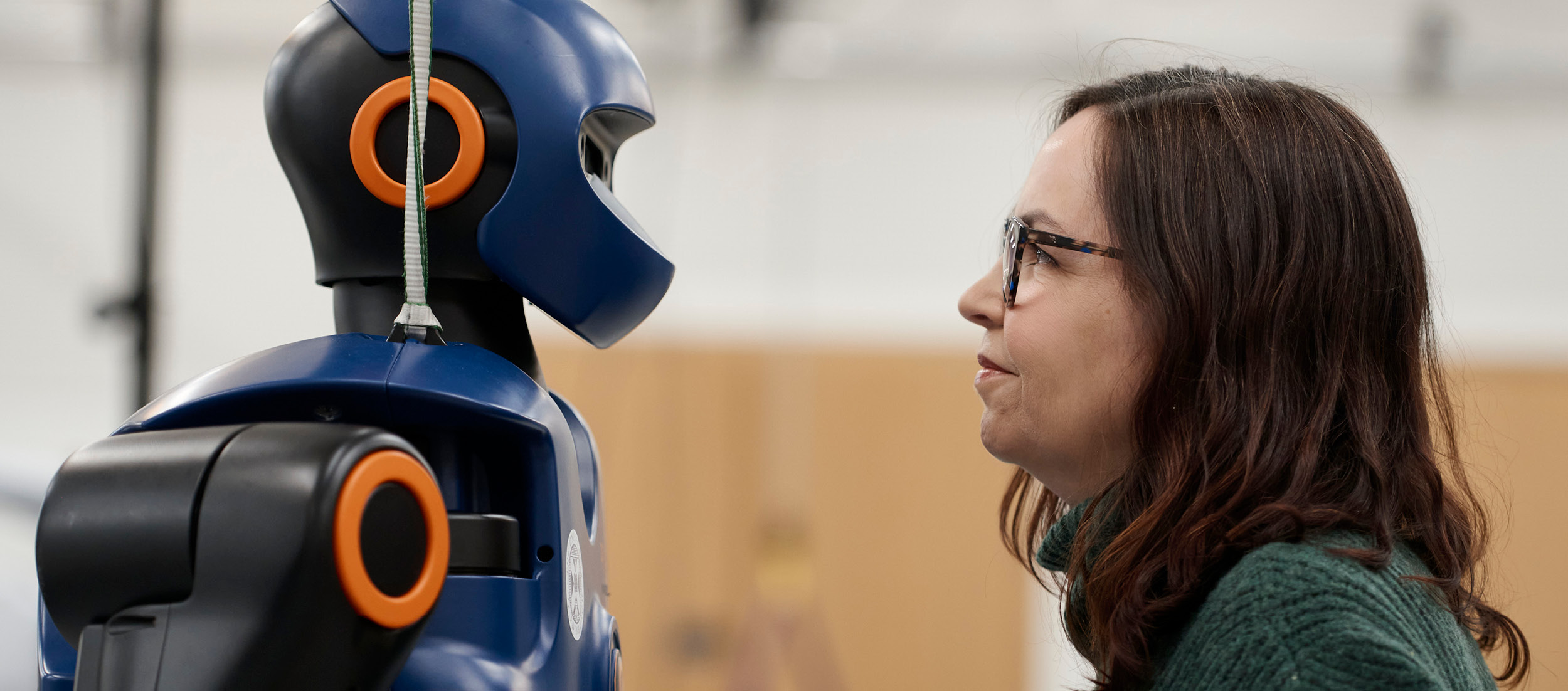 Image of Shannon Vallor face to face with a robot