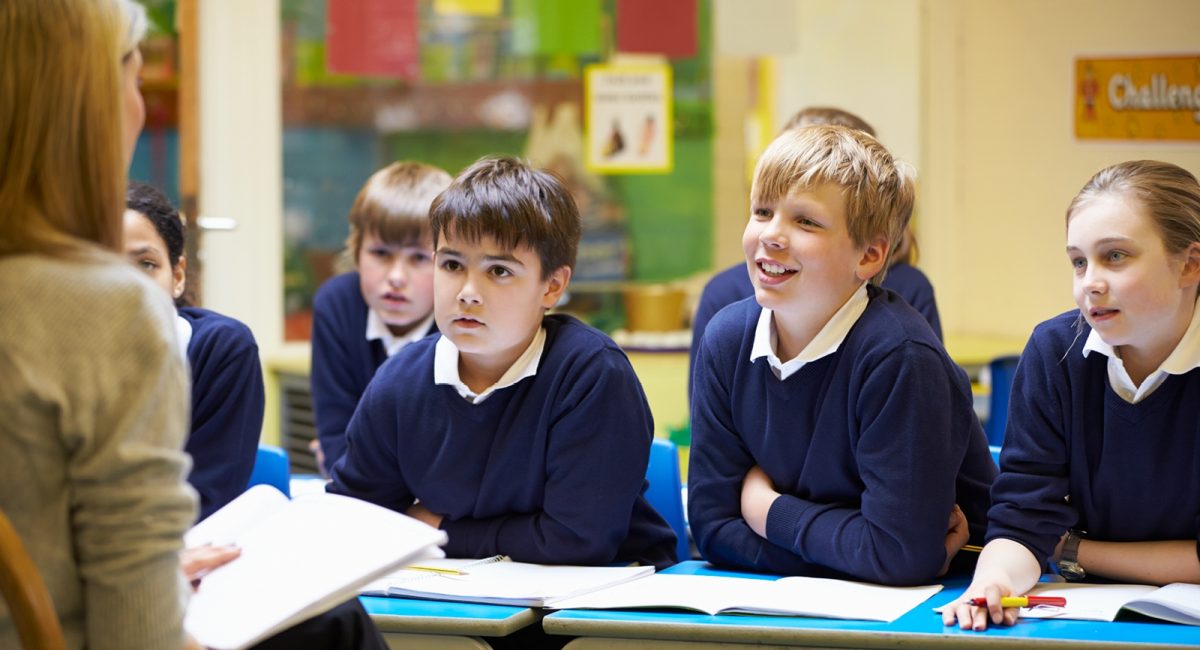 Image of children in a classroom with a teacher